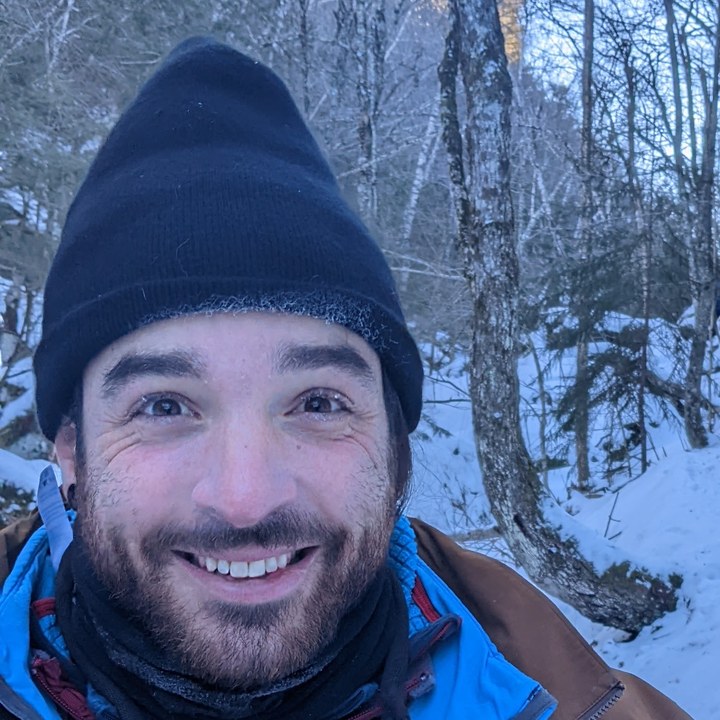 Arthur J. Anderson smiling on a snowy trail